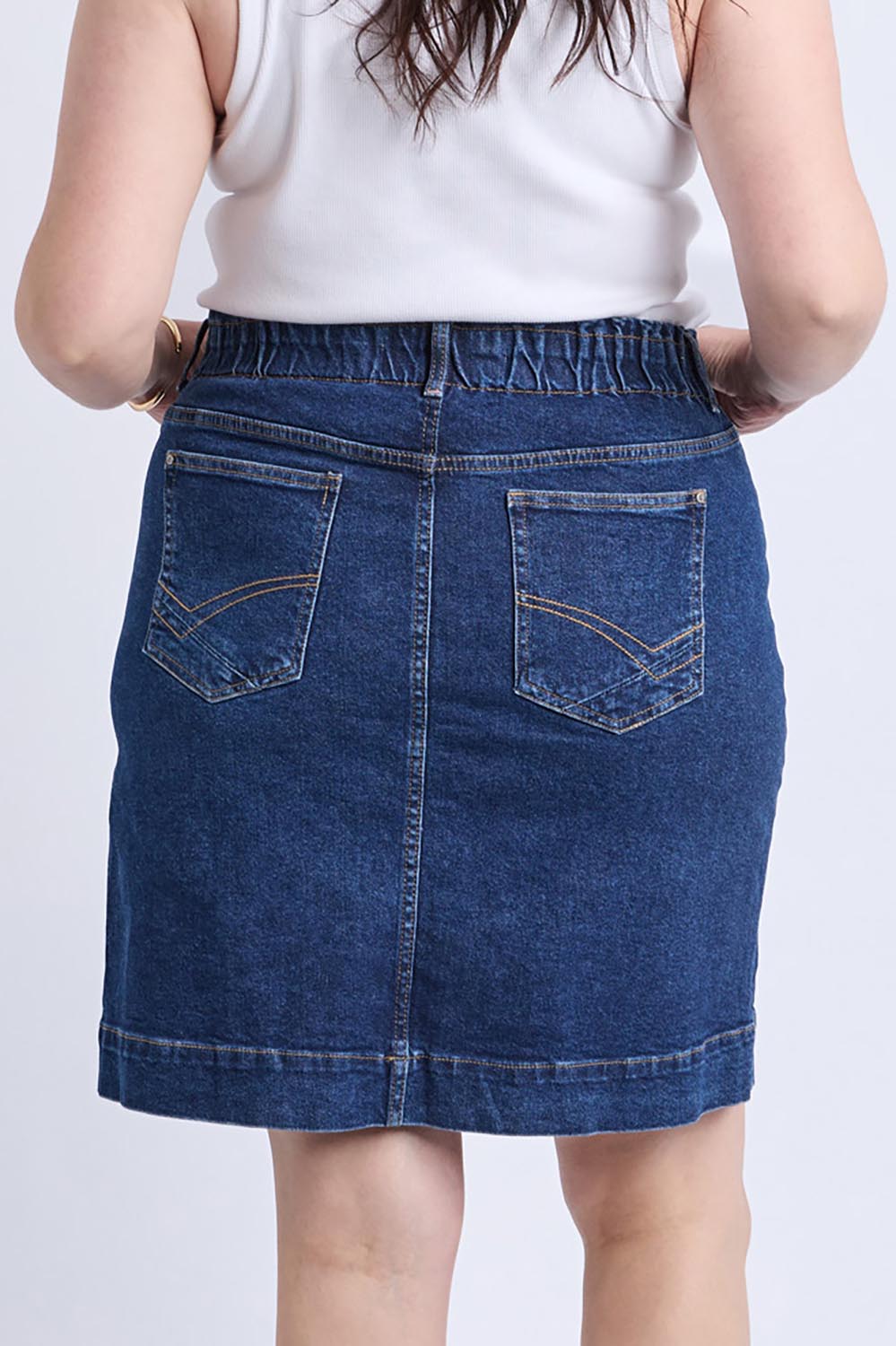 A model wearing the Lennox Denim Skirt in colour Drkblue (Blue), from the back