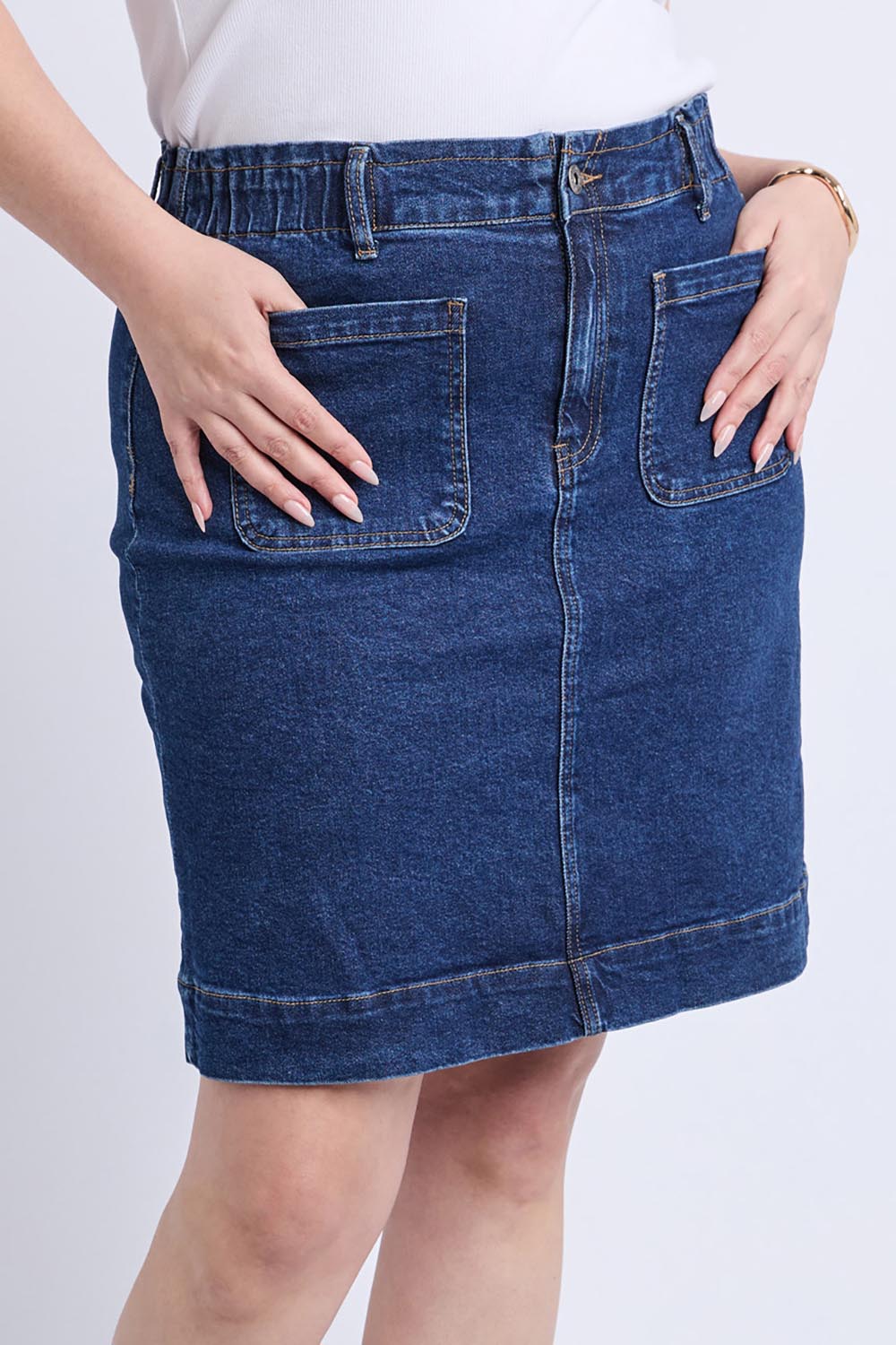 A model wearing the Lennox Denim Skirt in colour Drkblue (Blue), from the front, cropped image