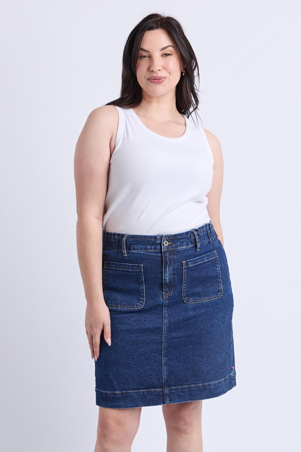 A model wearing the Lennox Denim Skirt in colour Drkblue (Blue), from the front, cropped image
