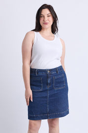 A model wearing the Lennox Denim Skirt in colour Drkblue (Blue), from the front, cropped image