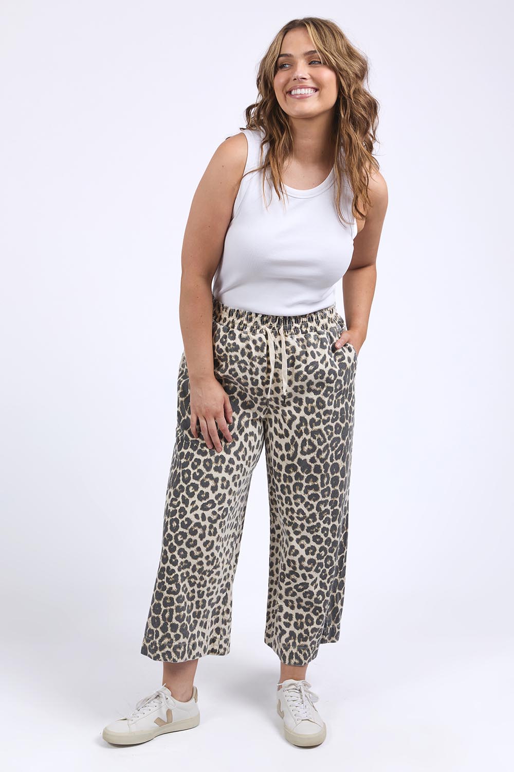 A model wearing the Animal Elastic Waist Pant in colour Animal, from the front, showing the whole outfit