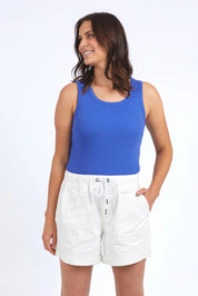 A model wearing the Fundamental Emma Relaxed Denim Short in colour Vinwhite (White), from the front, cropped image
