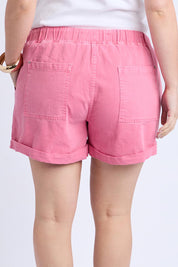 A model wearing the Emma Relaxed Denim Short in colour Chateauros (Pink), from the back