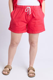 A model wearing the Emma Relaxed DenimShort in colour Poppy (Red), from the front, cropped image