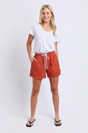 Model Genericm wearing size sample of the Fundamental Emma Relaxed Denim Short – Earthbrown in colour Earthbrown, from the front
