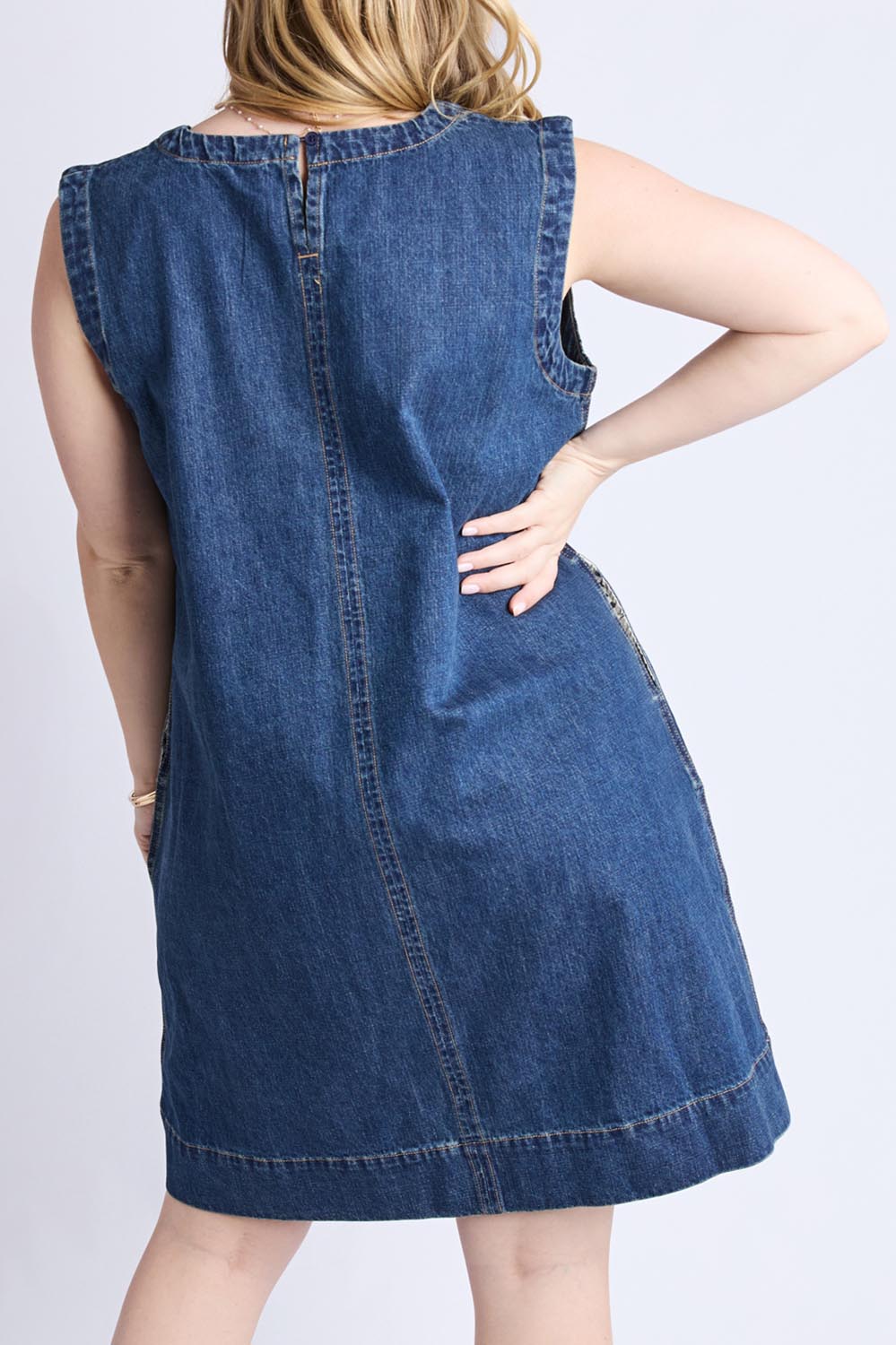A model wearing the Sonny Denim Dress in colour Darkblue (Blue), from the back