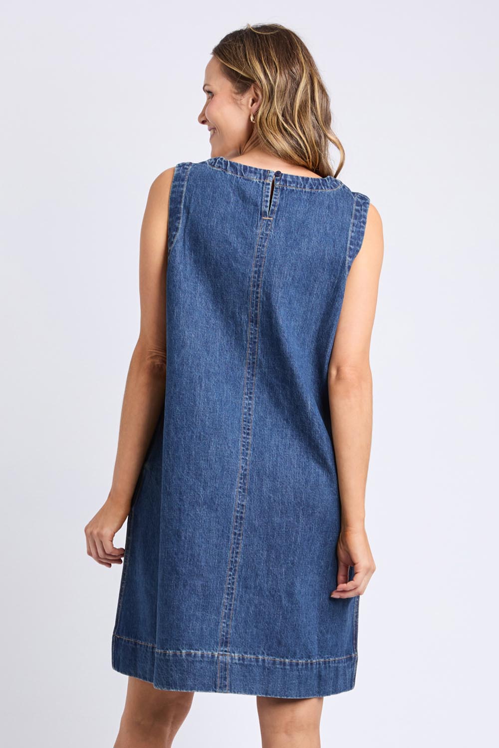 A model wearing the Sonny Denim Dress in colour Darkblue (Blue), from the back