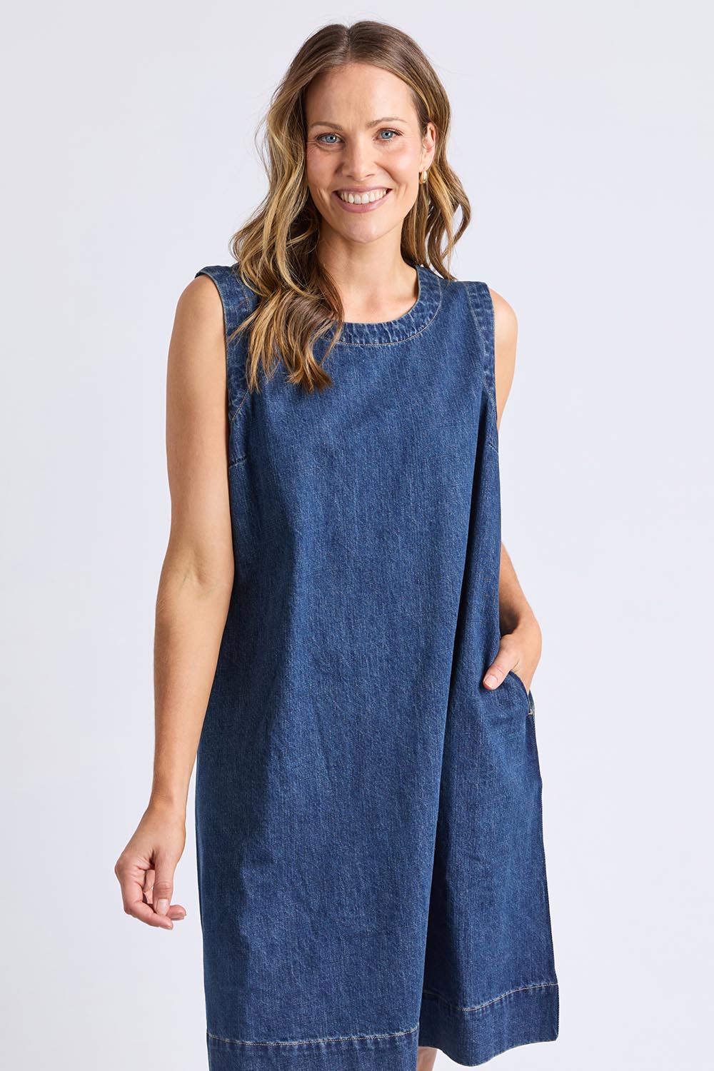 A model wearing the Sonny Denim Dress in colour Darkblue (Blue), from the front, cropped image