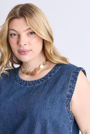 A model wearing the Sonny Denim Dress in colour Darkblue (Blue), from the front, cropped image