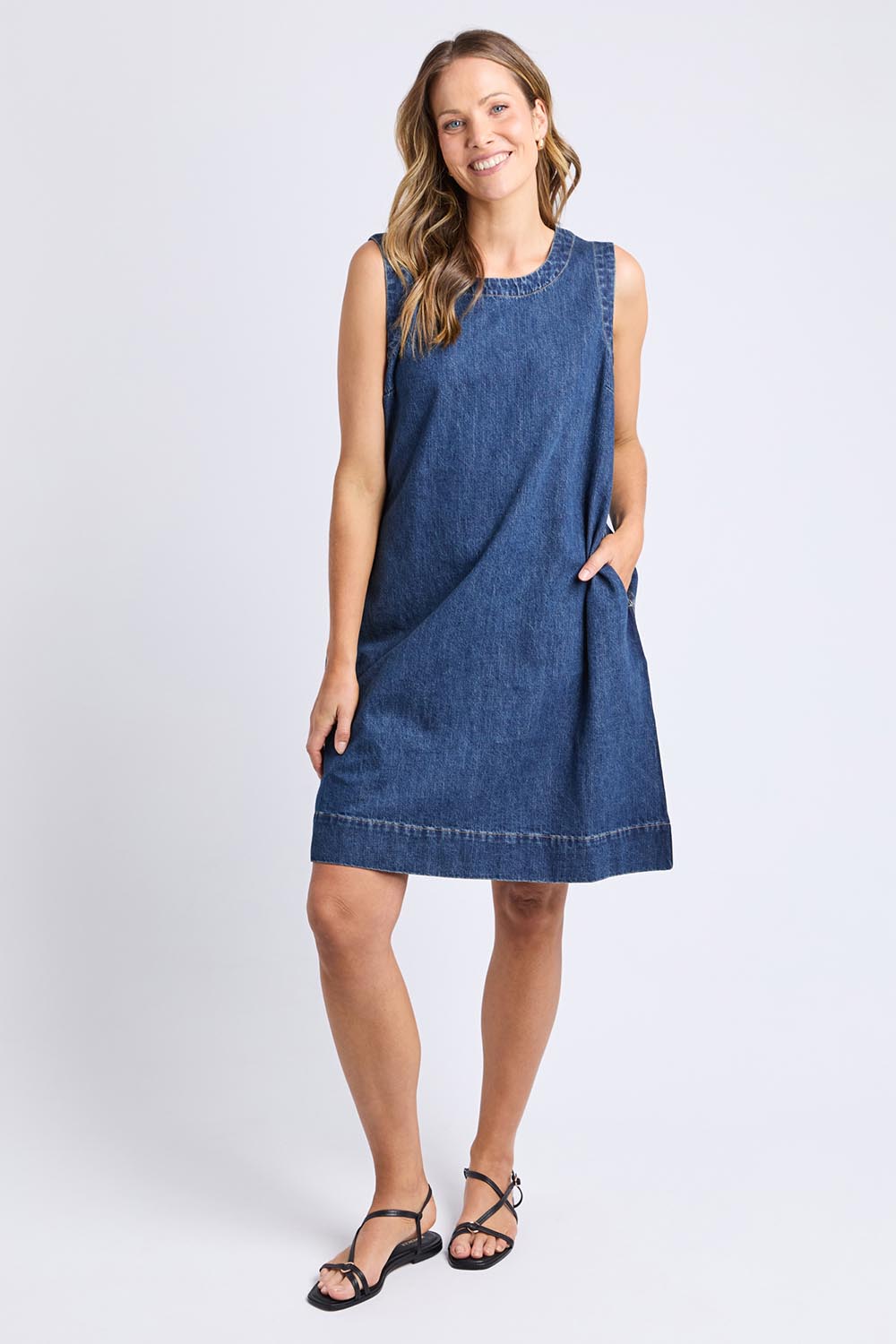 A model wearing the Sonny Denim Dress in colour Darkblue (Blue), from the front, showing the whole outfit