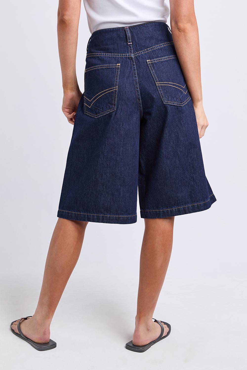 Model Genericm wearing size sample of the Faith Denim Shorts – Dblue in colour Dblue, from the back