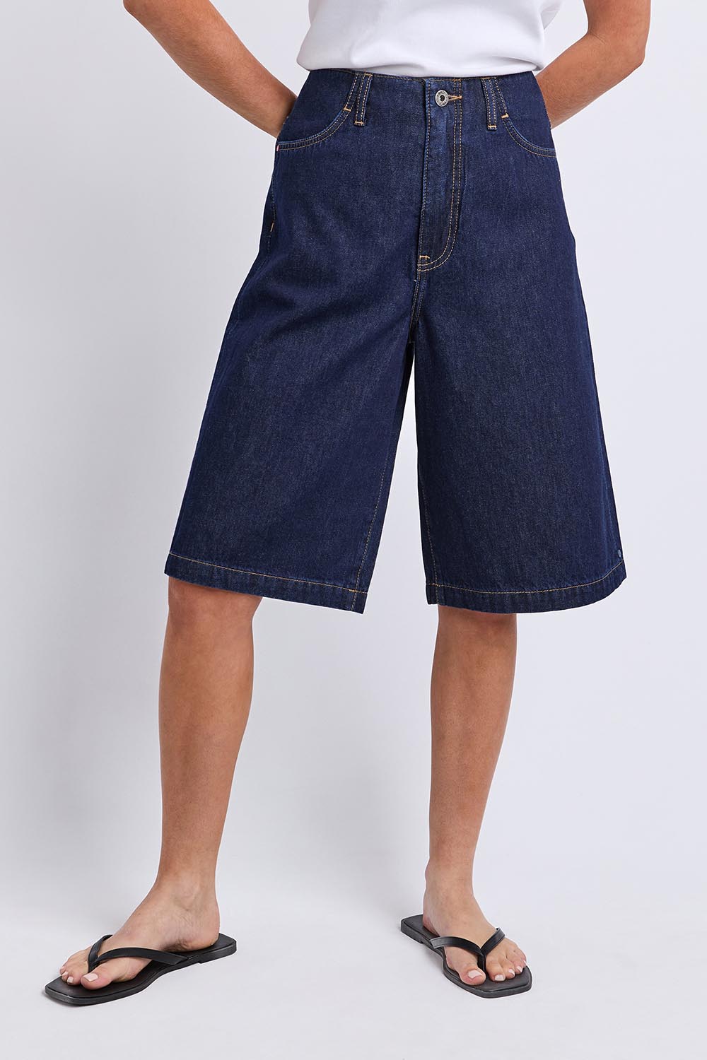 Model Genericm wearing size sample of the Faith Denim Shorts – Dblue in colour Dblue, in a cropped view