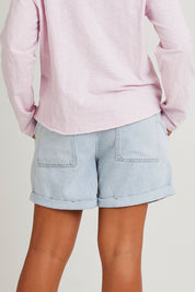Model Olivia wearing size 10 of the Fundamental Emma Relaxed Short in colour Lghtblue (Blue), from the back