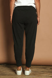 Model Katie wearing size 10 of the Fundamental Brunch Cotton Pant in colour Black (Black), from the back