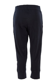 Product shot of the Fundamental Brunch Cotton Pant in colour Black (Black), from the back