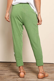 Model Pamelar wearing size 10 of the Fundamental Brunch Cotton Pant - Cedargreen in colour Cedargreen, from the back