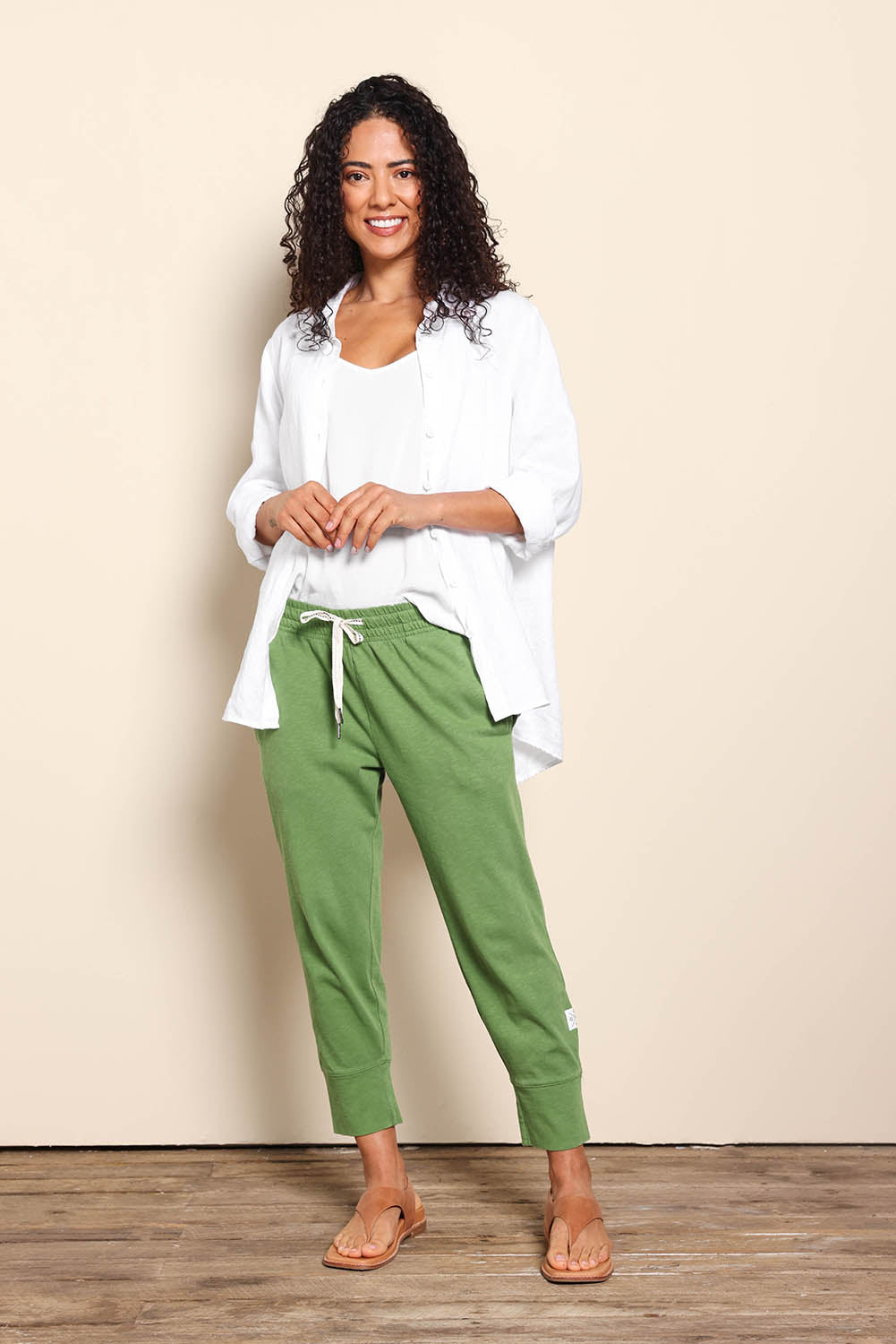 Model Pamelar wearing size 10 of the Fundamental Brunch Cotton Pant - Cedargreen in colour Cedargreen, from the front
