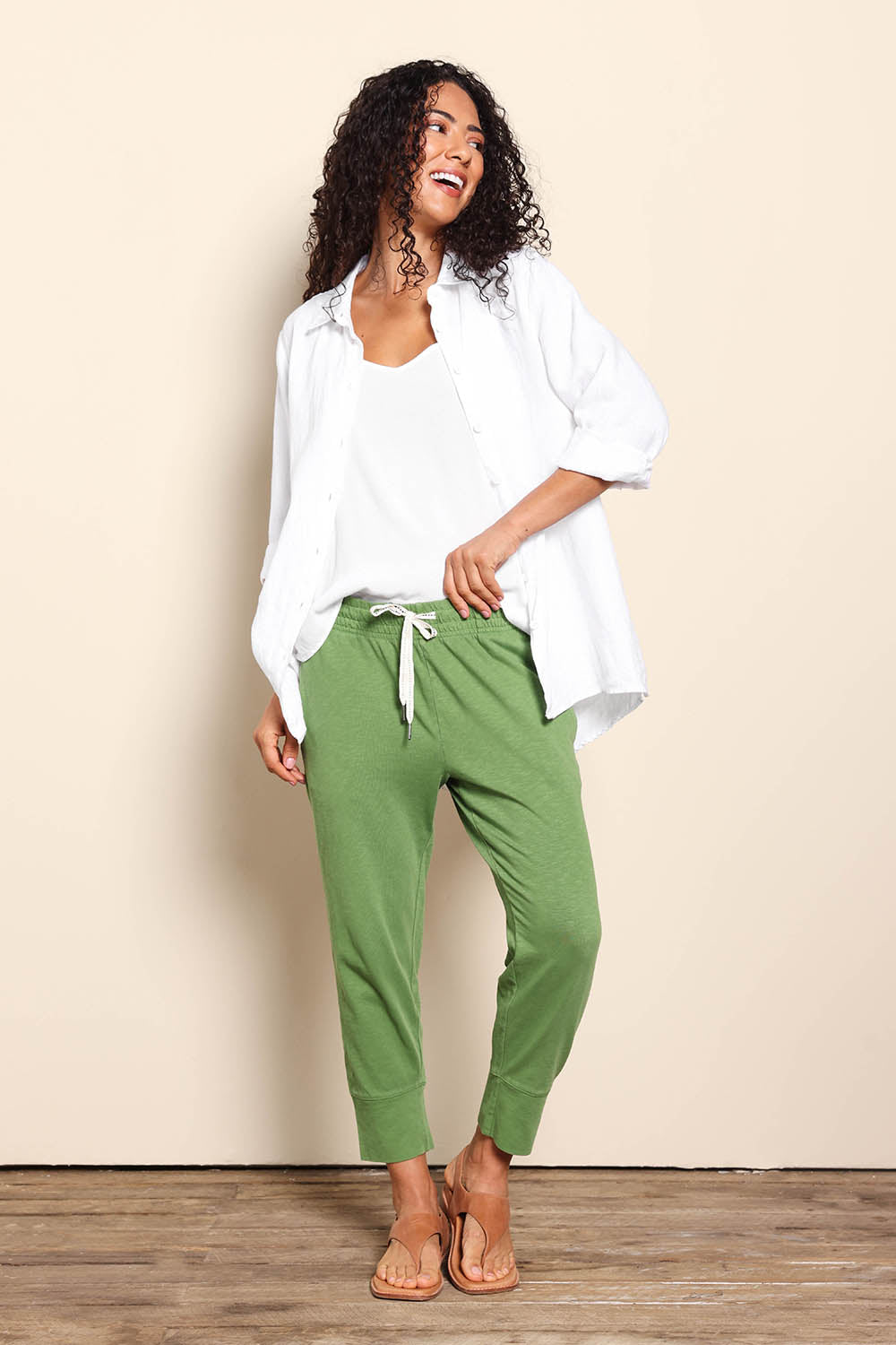 Model Pamelar wearing size 10 of the Fundamental Brunch Cotton Pant - Cedargreen in colour Cedargreen, from the front