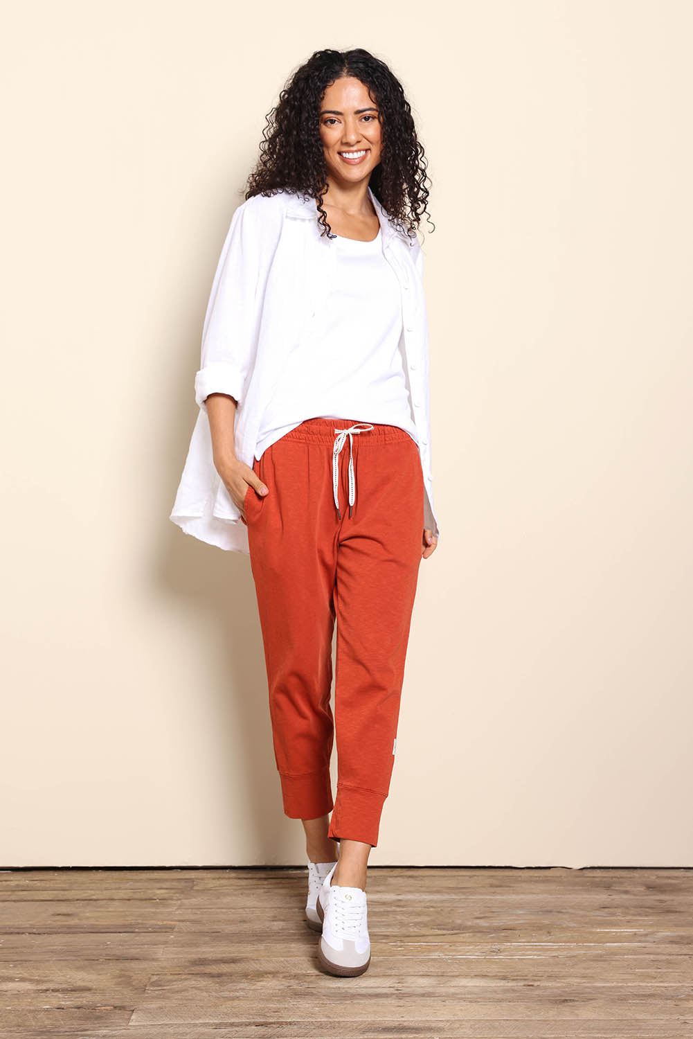 Model Pamelar wearing size 10 of the Fundamental Brunch Cotton Pant – Earthbrown in colour Earthbrown, from the front
