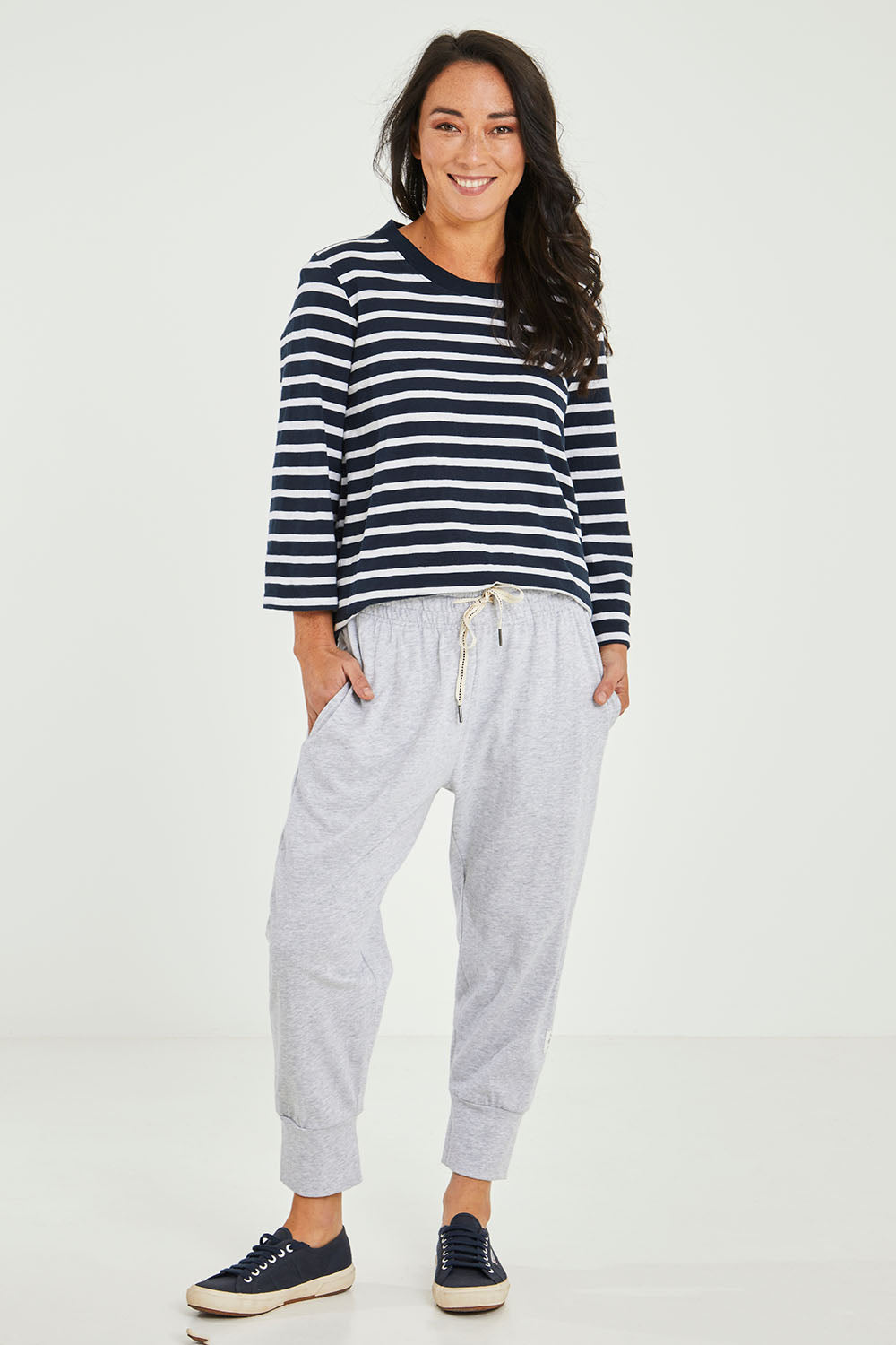 Model Katie wearing size 10 of the Fundamental Brunch Cotton Pant in colour Greymarl (Grey), from the front, showing the whole outfit