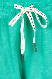 Product shot of the Fundamental Brunch Cotton Pant in colour Gumdrop (Green), detail