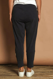 Model Katie wearing size 10 of the Fundamental Brunch Cotton Pant in colour Navy (Blue), from the back