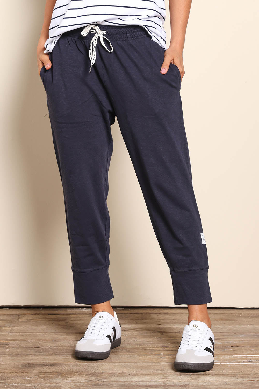 Model Pamelar wearing size 10 of the Fundamental Brunch Cotton Pant - Navy in colour Navy, in a cropped view