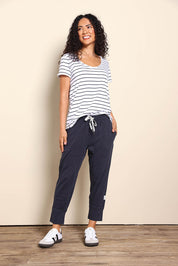 Model Pamelar wearing size 10 of the Fundamental Brunch Cotton Pant - Navy in colour Navy, from the front