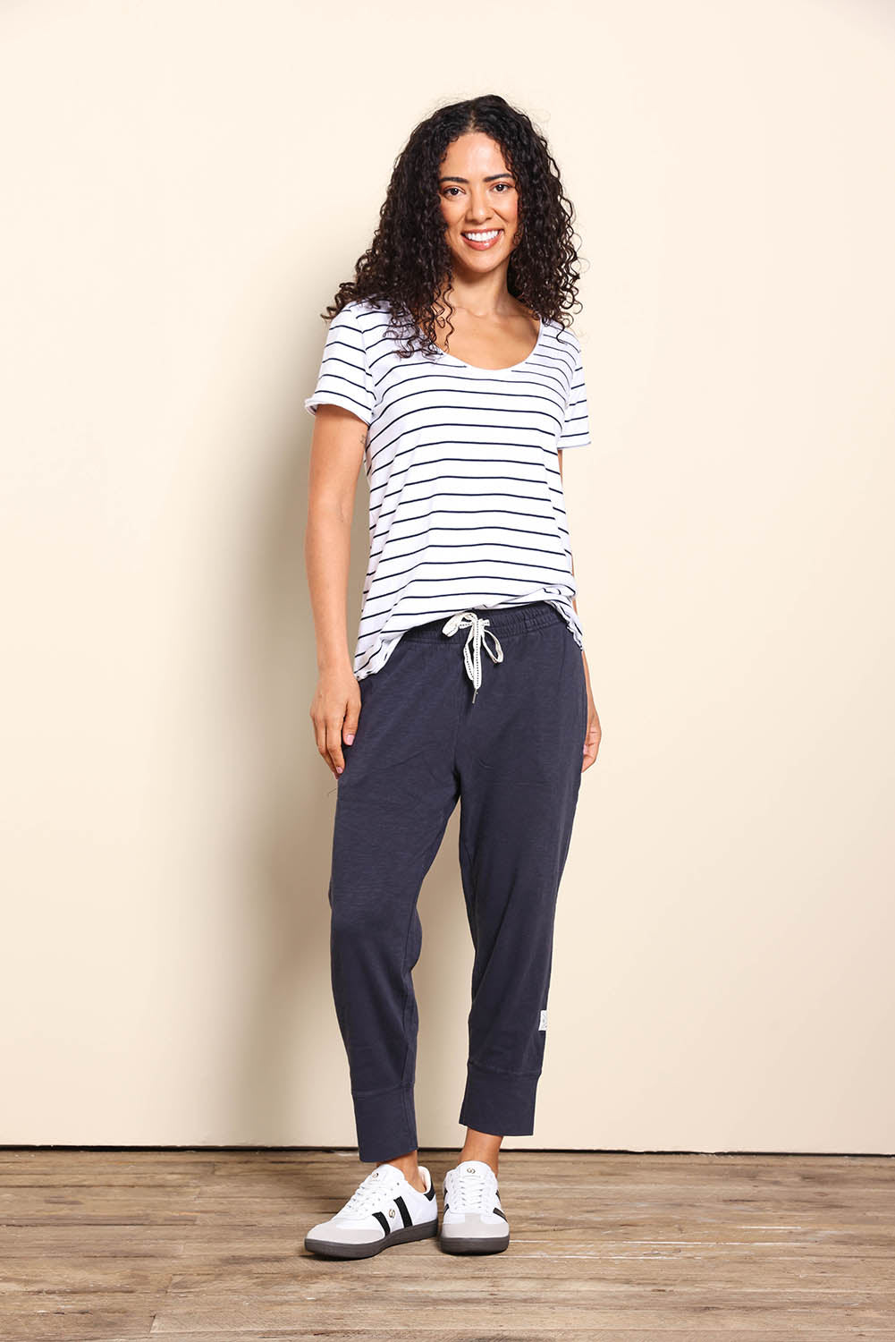Model Pamelar wearing size 10 of the Fundamental Brunch Cotton Pant - Navy in colour Navy, from the front