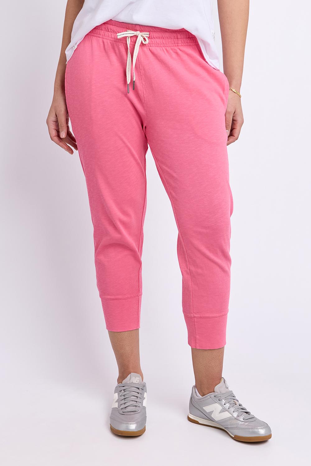 Model Genericm wearing size sample of the Fundamental Brunch Cotton Pant – Pinklemon in colour Pinklemon, in a cropped view