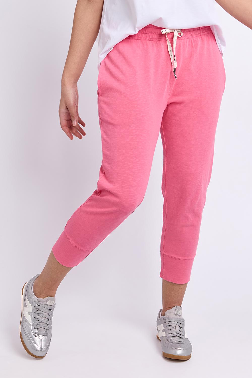 Model Genericm wearing size sample of the Fundamental Brunch Cotton Pant – Pinklemon in colour Pinklemon, in a cropped view