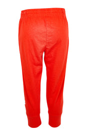 Product shot of the Fundamental Brunch Cotton Pant – Tangello in colour Tangello, from the back