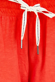 Product shot of the Fundamental Brunch Cotton Pant – Tangello in colour Tangello, showing detail
