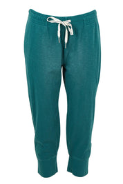 Product shot of the Fundamental Brunch Cotton Pant in colour Teal (Green), from the front