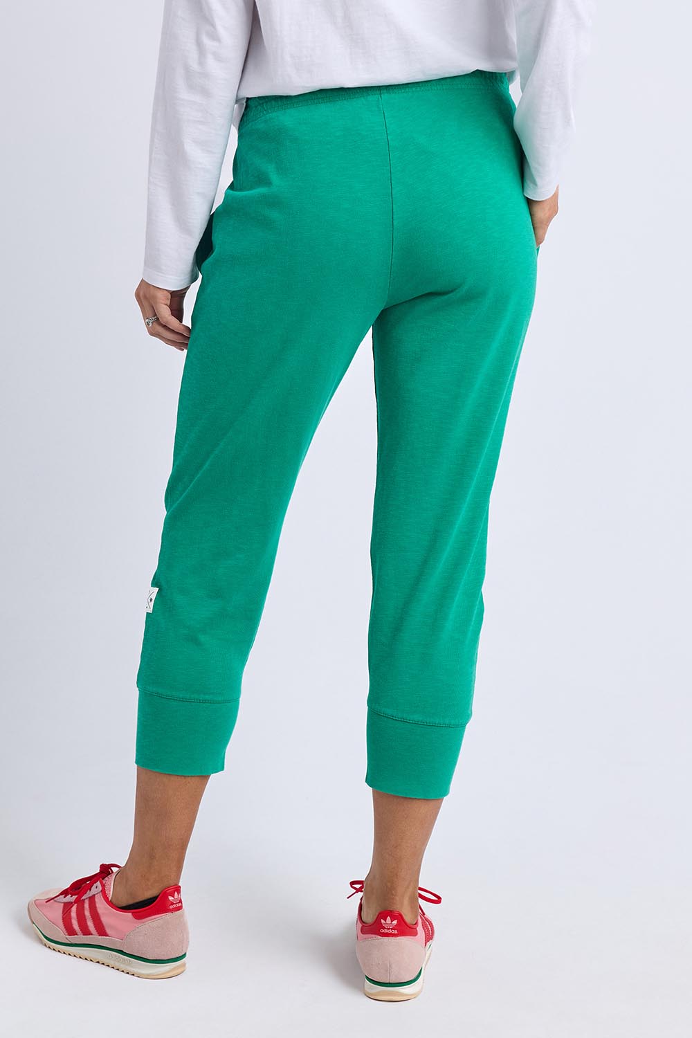 A model wearing the Fundamental Brunch Cotton Pant in colour Turquoise (Green), from the back