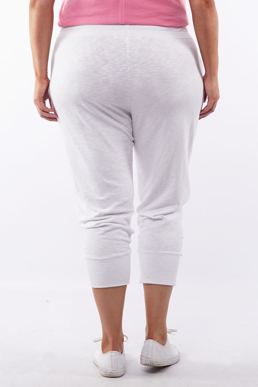 A model wearing the Fundamental Brunch Cotton Pant in colour White (White), from the back