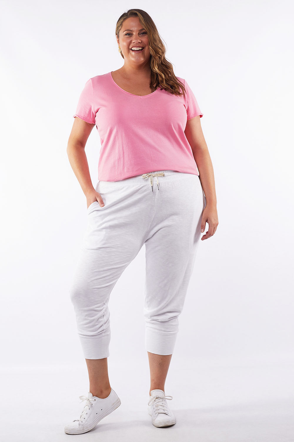 A model wearing the Fundamental Brunch Cotton Pant in colour White (White), from the front, showing the whole outfit