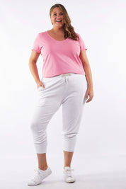 A model wearing the Fundamental Brunch Cotton Pant in colour White (White), from the front, showing the whole outfit