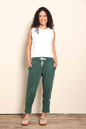 Model Pamelar wearing size 10 of the Fundamental Brunch Cotton Pant - Wintgreen in colour Wintgreen, from the front