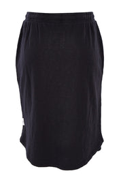 Product shot of the Fundamental Isla Skirt in colour Black (Black), from the back