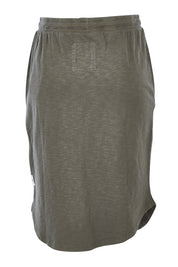 Product shot of the Fundamental Isla Skirt in colour Khaki (Green), from the back