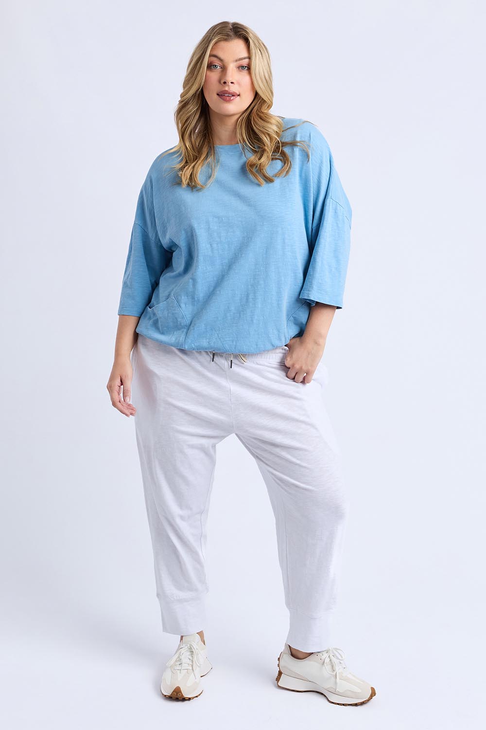 A model wearing the Fundamental Mazie Cotton Sweat Top in colour Duskblue (Blue), from the front, showing the whole outfit