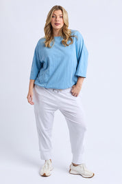 A model wearing the Fundamental Mazie Cotton Sweat Top in colour Duskblue (Blue), from the front, showing the whole outfit