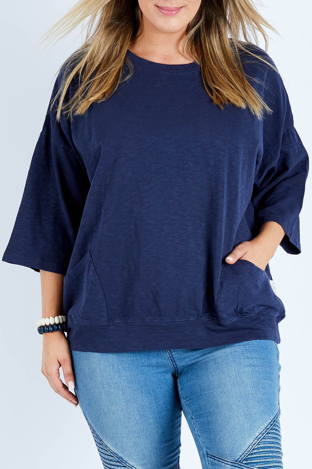 Model Jess wearing size 14 of the Fundamental Mazie Cotton Sweat Top in colour Navy (Blue), from the front, cropped image