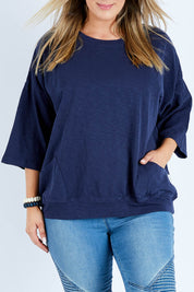 Model Jess wearing size 14 of the Fundamental Mazie Cotton Sweat Top in colour Navy (Blue), from the front, cropped image