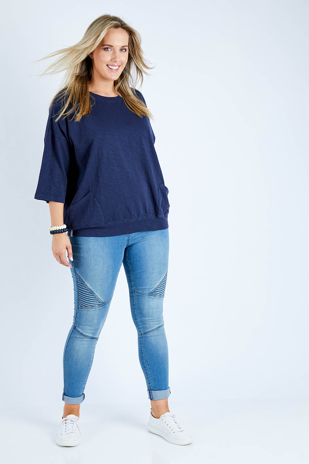 Model Jess wearing size 14 of the Fundamental Mazie Cotton Sweat Top in colour Navy (Blue), from the front, showing the whole outfit