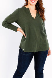 Model Jessica wearing size 14 of the Fundamental Coles Bay Henley in colour Darkkhaki (Green), from the front, cropped image