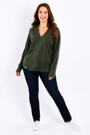Model Jessica wearing size 14 of the Fundamental Coles Bay Henley in colour Darkkhaki (Green), from the front, showing the whole outfit