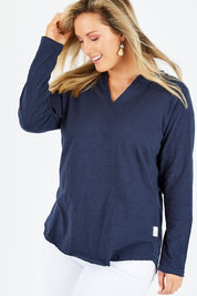 Model Jess wearing size 14 of the Fundamental Coles Bay Henley in colour Navy (Blue), from the front, cropped image
