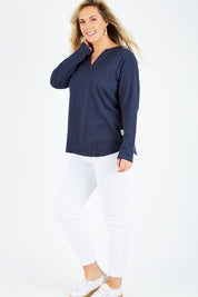 Model Jess wearing size 14 of the Fundamental Coles Bay Henley in colour Navy (Blue), from the front, showing the whole outfit